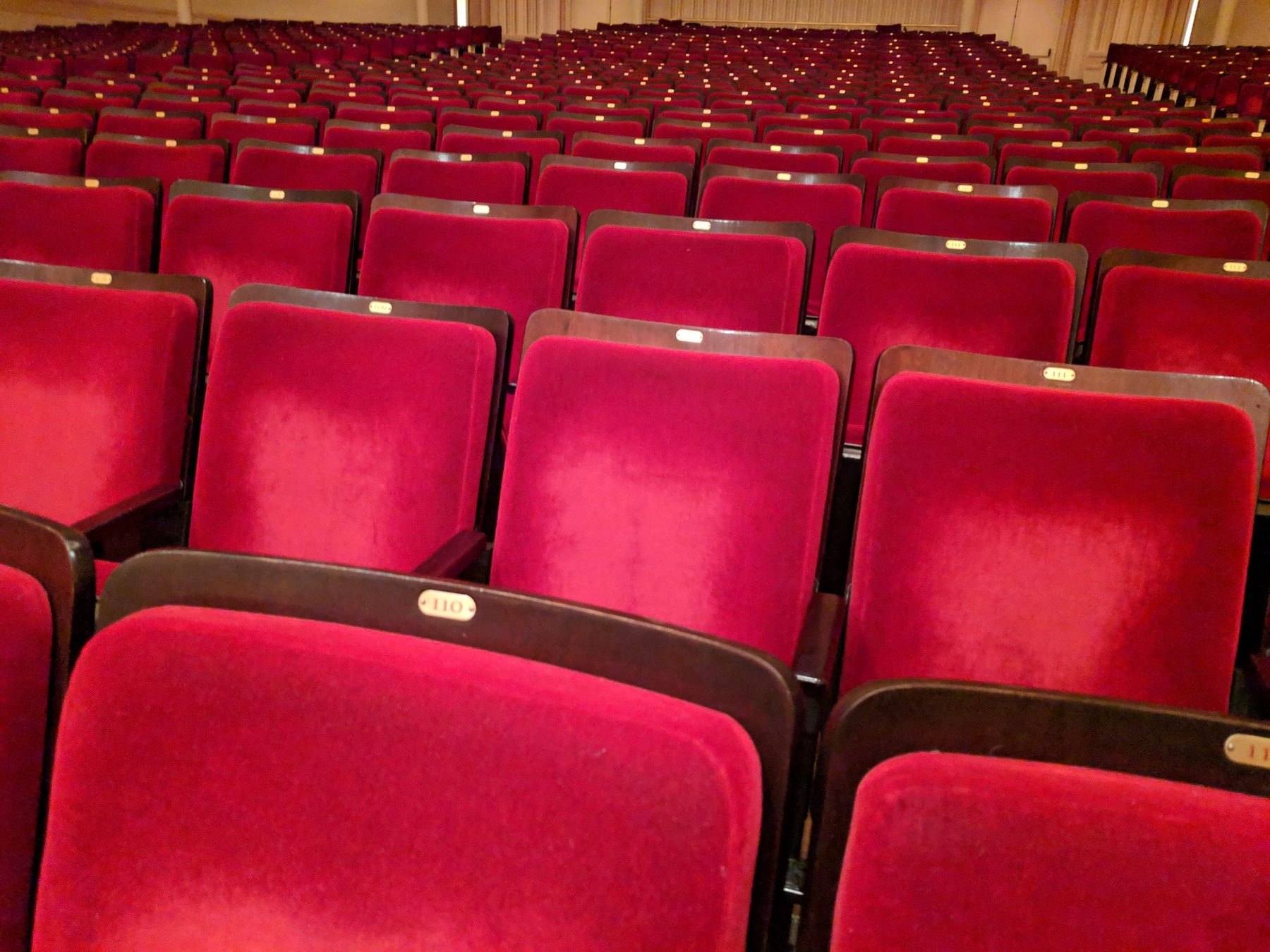 The crimson velvet seats of Carnegie Hall, awaiting an audience